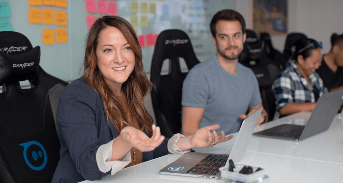 Home female and male sitting at desk with a computer in front of them